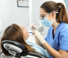 Dentist examining a patient teeth