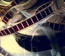 An old film with a movie on the roll.